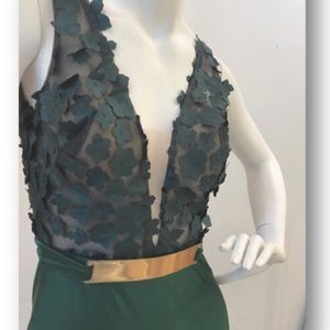 Dark green gown with flower appliqué